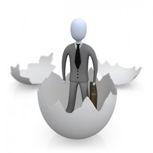 Businessman Carrying A Briefcase And Coming Out Of An Eggshell Clipart Illustration Image